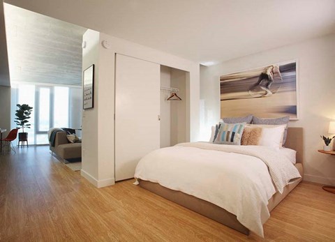 One Bedroom Apartments in Portland OR - Yard - Open Layout Bedroom with Wood-Style Flooring and Attatched Closet